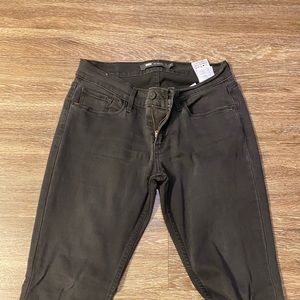 Levi’s 524 Skinny. Faded black w/ ripped patch